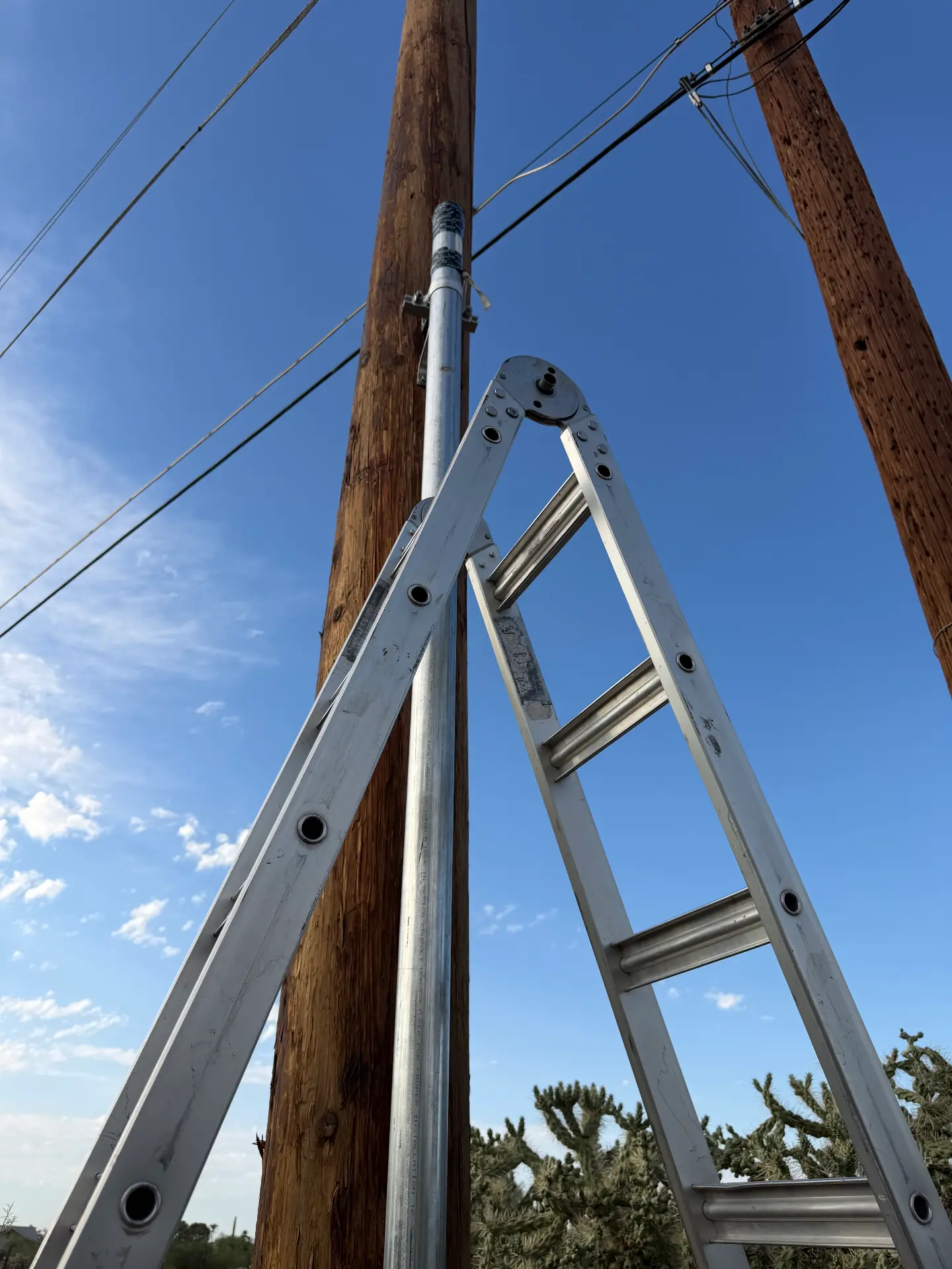 Utility pole service riser and overhead line connection work