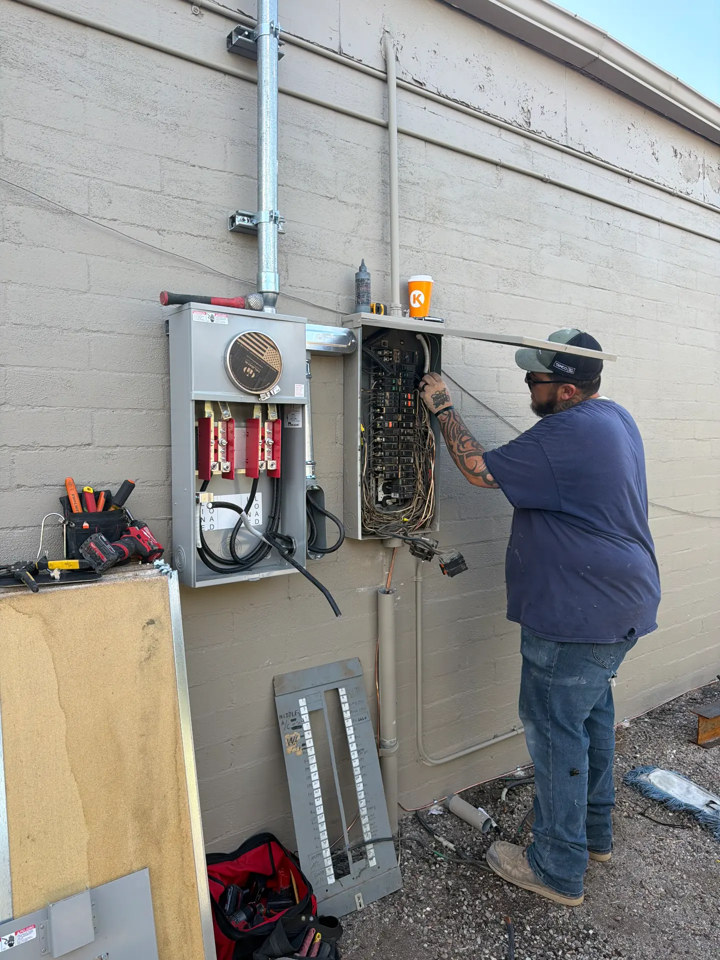 Elite Electrical Solution electrician installing electrical panels